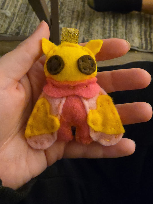 Handmade felt Rosy Maple Moth keychain front view with silver keychain hardware
